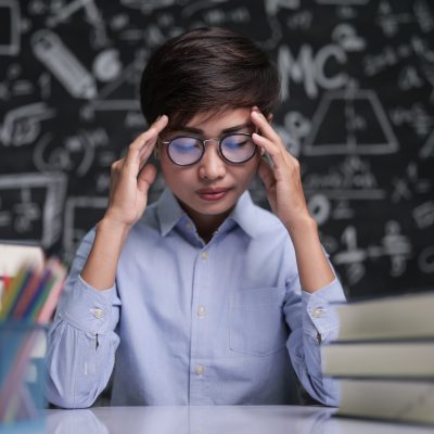 The teacher sat thinking about teaching in the classroom